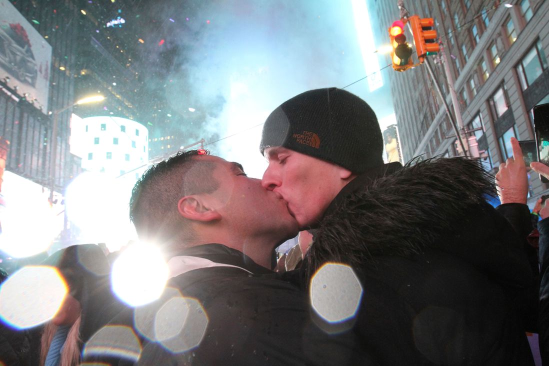Willam Moreno, from Denver, left, and his boyfriend James William Neely, from New York, kiss shortly after midnight in New York's Times Square (Tina Fineberg/AP/Shutterstock)
